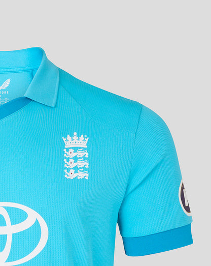 Blue polo shirt with a white logo on a light gray background