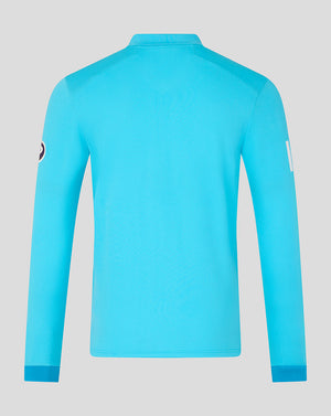 Blue long-sleeve shirt on a light gray background