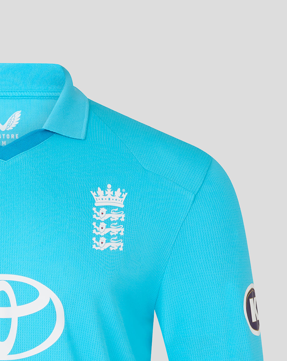 Close-up of a turquoise sports jersey with logos on a light gray background