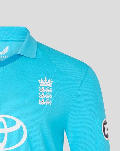 Close-up of a turquoise sports jersey with logos on a light gray background