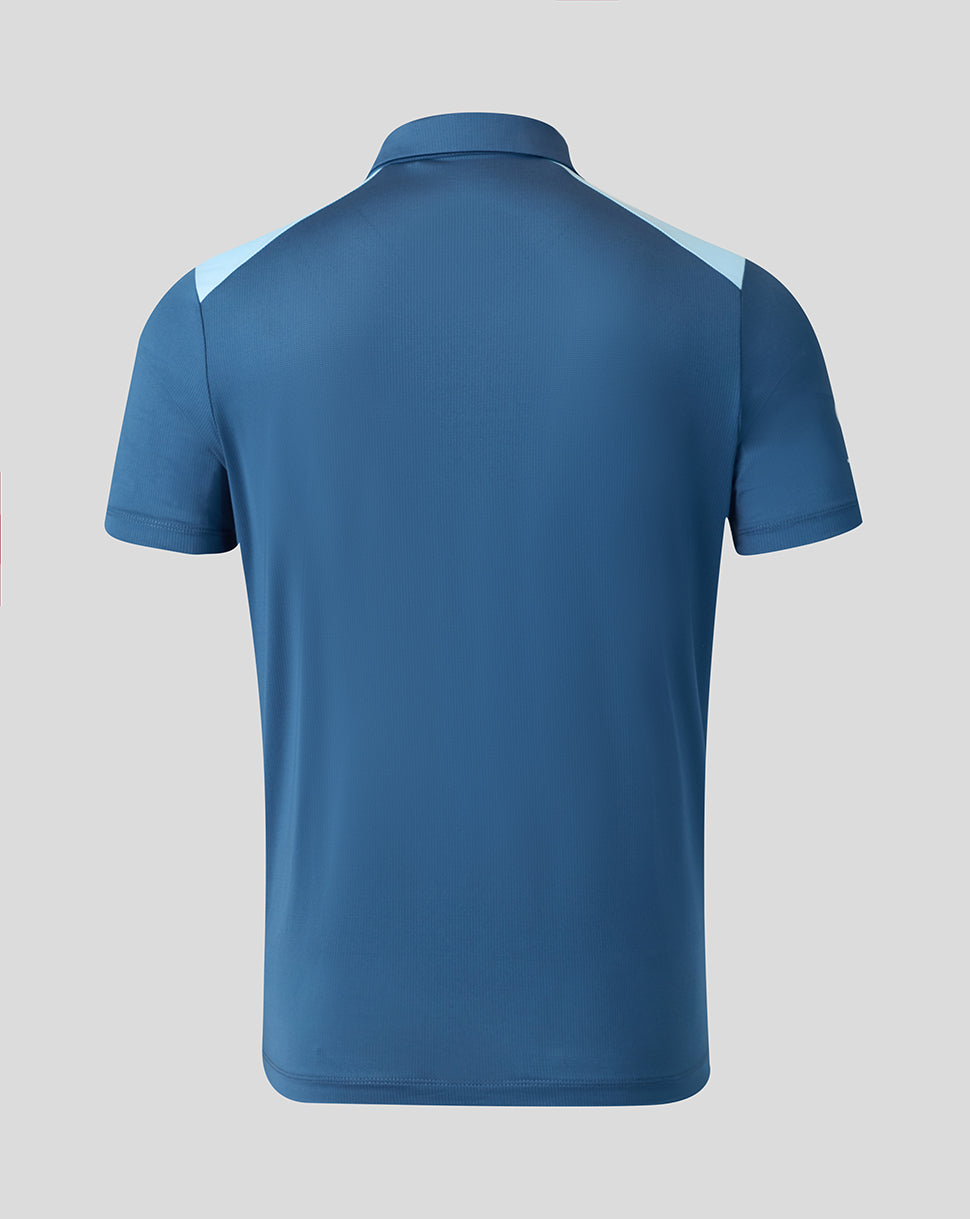 Blue polo shirt with white accents on a gray background