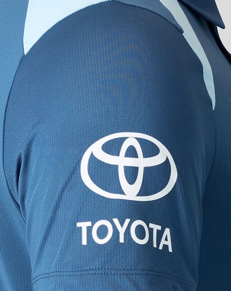 Blue shirt with Toyota logo on the back
