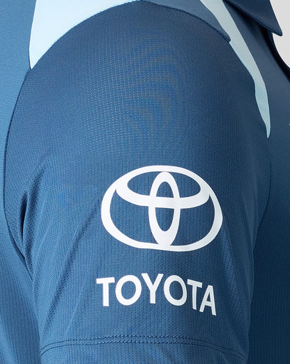 Blue shirt with Toyota logo on the back