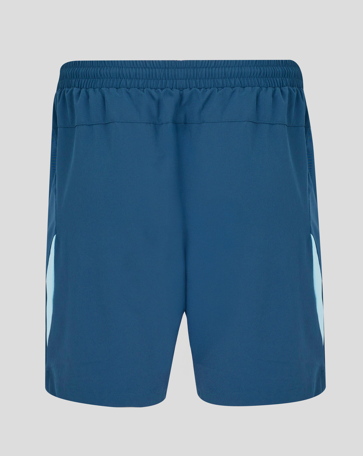 Blue athletic shorts on a gray background
