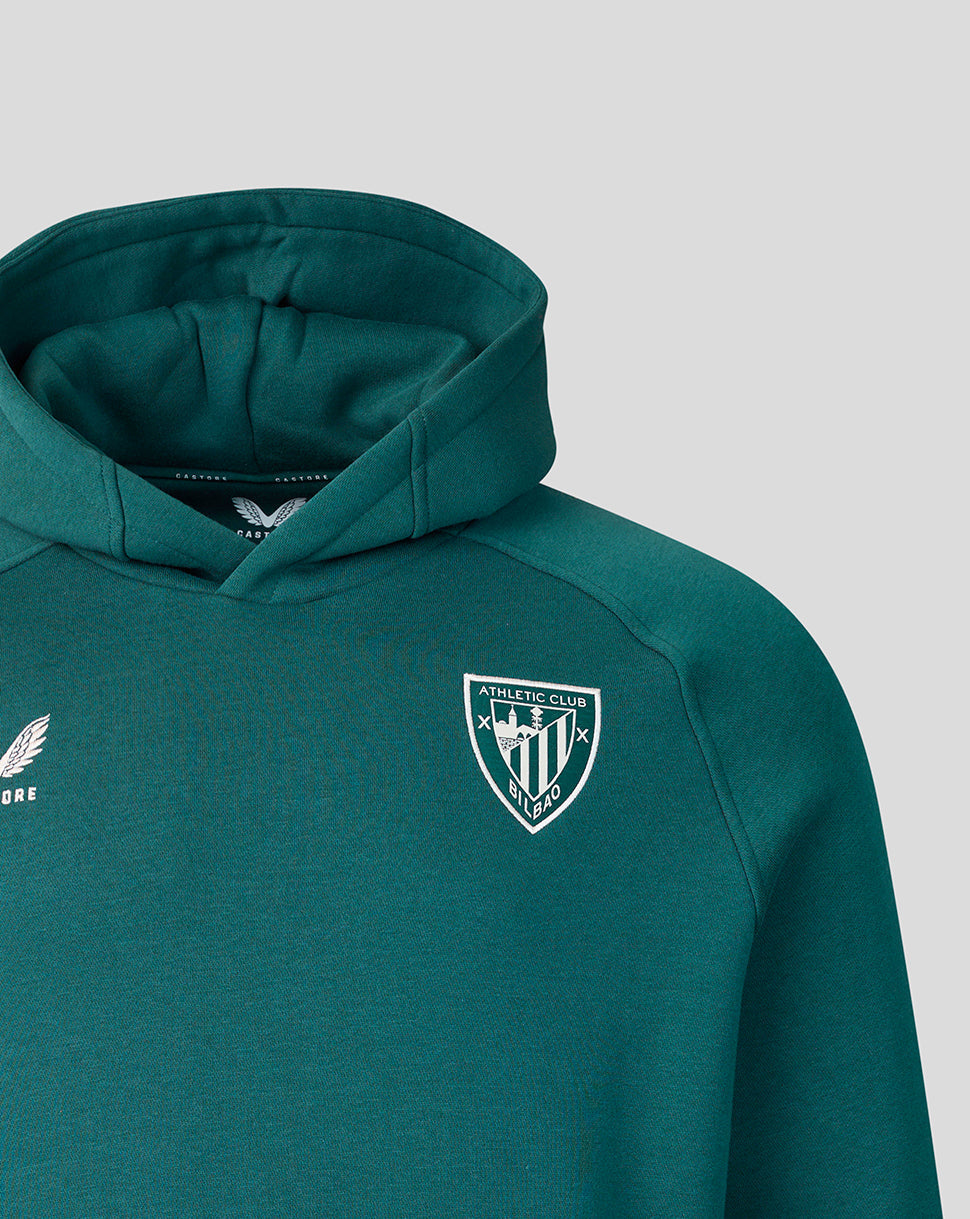 Teal hoodie close-up highlighting the hood and crest emblem on the chest.