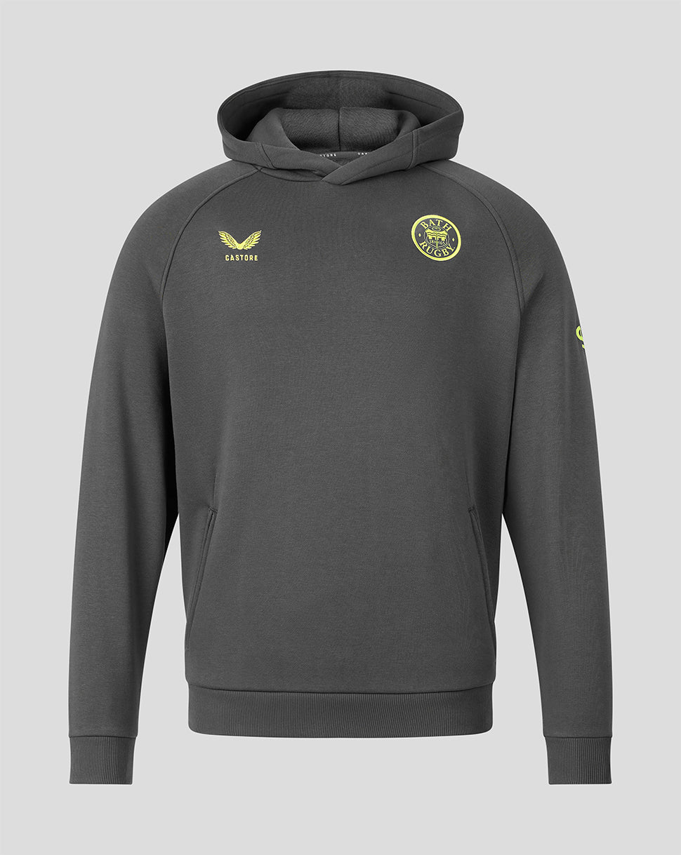 A dark gray pullover hoodie with yellow-green printed logos, including a circular crest on the left chest and a winged logo on the right chest, displayed against a solid light gray background.