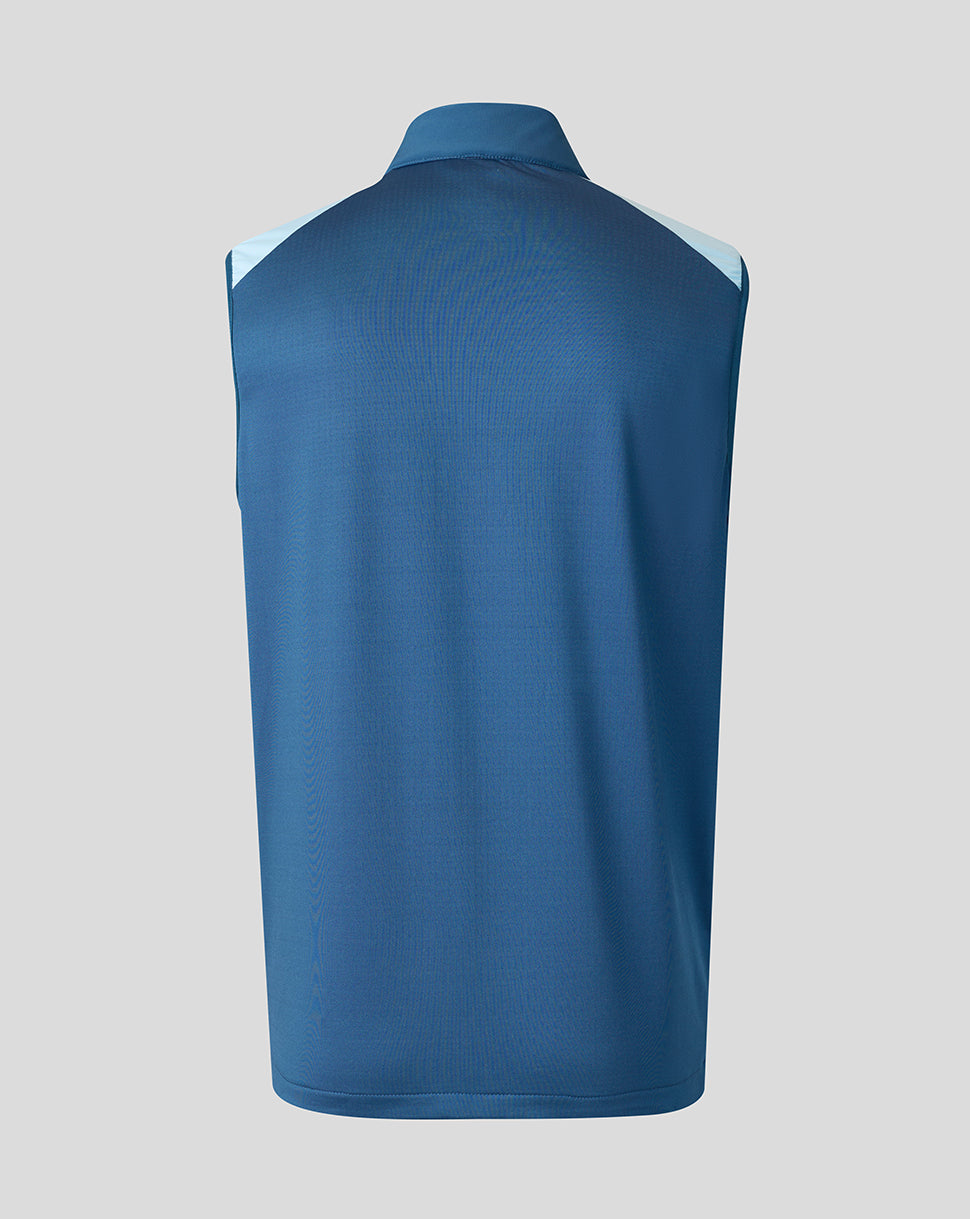 Blue sleeveless shirt on a gray background