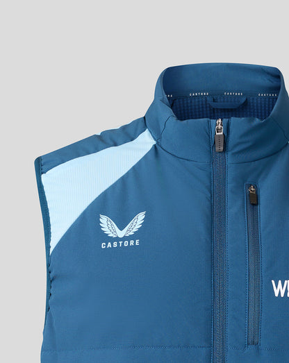 Blue vest with a visible brand logo on a gray background