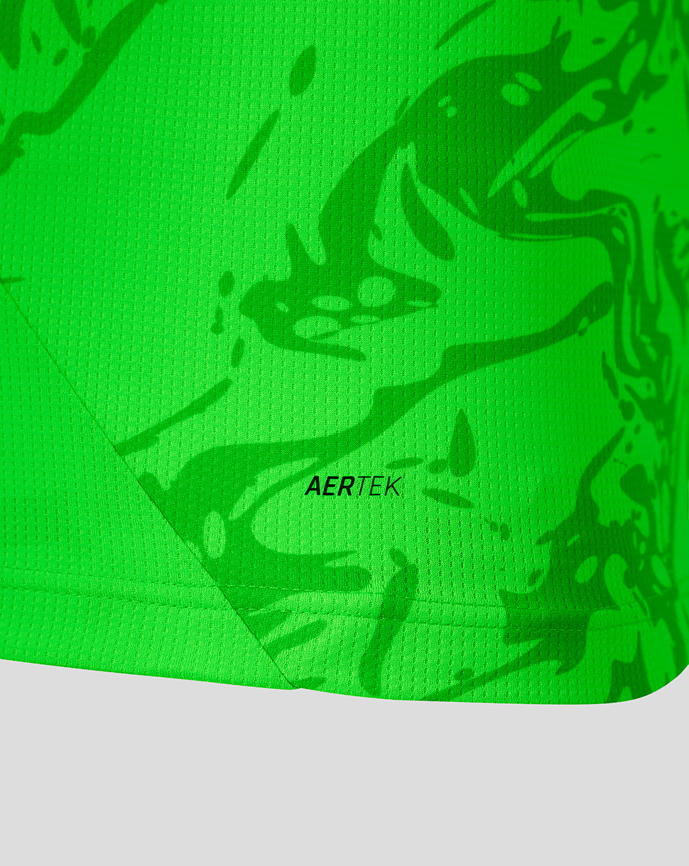 Close-up of a bright neon green athletic fabric with a darker green abstract pattern and the visible AERTEK logo near the center.