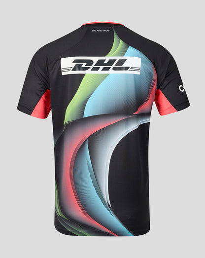 A short-sleeve athletic jersey shown from the back, featuring a black base with a large abstract wave graphic in light blue, green, and pink, plus a white DHL logo across the upper back.