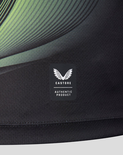 Close-up of a black athletic garment with a visible Castore Authentic Product label on the chest.
