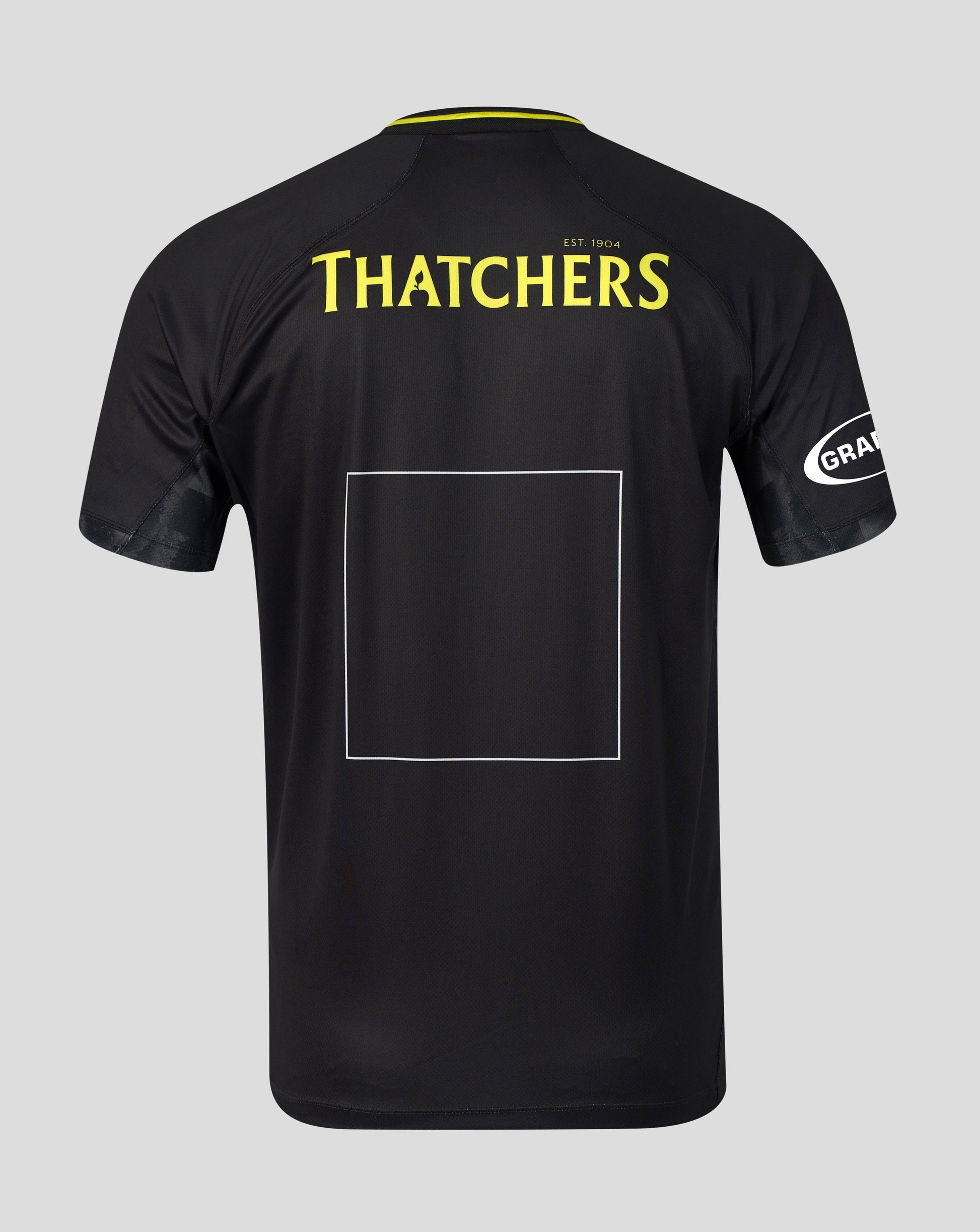 Black short-sleeve sports jersey shown from the back on a light gray background, featuring 'THATCHERS' in yellow text across the upper back, a large blank rectangular patch area in the center, and a white circular 'GRA' logo on the sleeve.