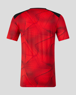 Back view of red Feyenoord home shirt with abstract black line pattern and black shoulder panels.