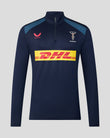 Navy long-sleeve athletic shirt with DHL logo on a gray background