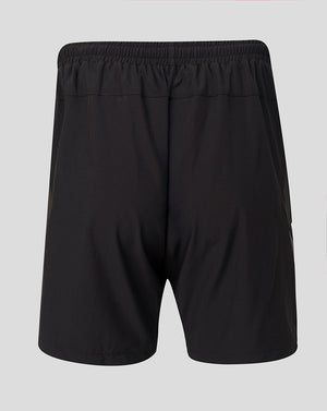 Black athletic shorts with an elastic waistband, shown from the back on a light gray background.
