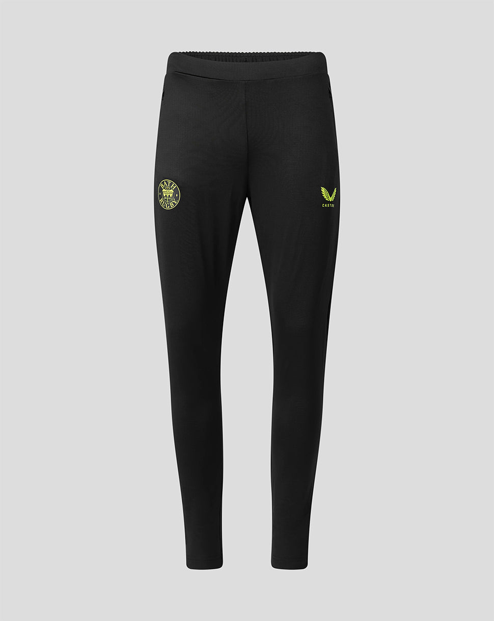 Black athletic jogger pants with a small yellow-green crest on the left thigh and a matching logo on the right thigh, shown against a light gray background.