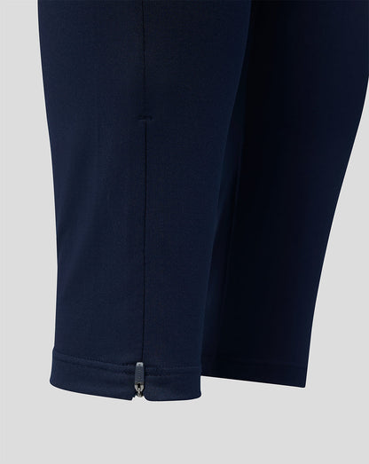 Navy blue pants with a zipper on a light gray background