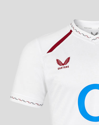 White sports jersey with red accents and 'Castore' branding on a gray background