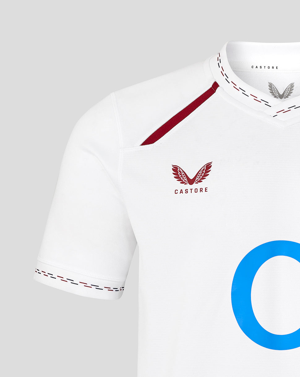 White sports jersey with red accents and 'Castore' branding on a light gray background