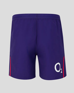 Purple shorts with a logo on a gray background
