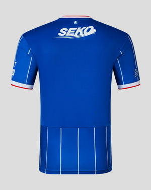 The back of a royal blue short-sleeve athletic jersey with white and red trim, featuring a large white 'SEKO' logo across the upper back and vertical white pinstripes.
