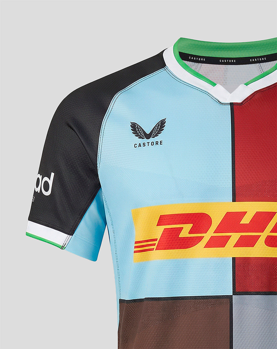 Multicolored rugby jersey with visible branding on a light gray background