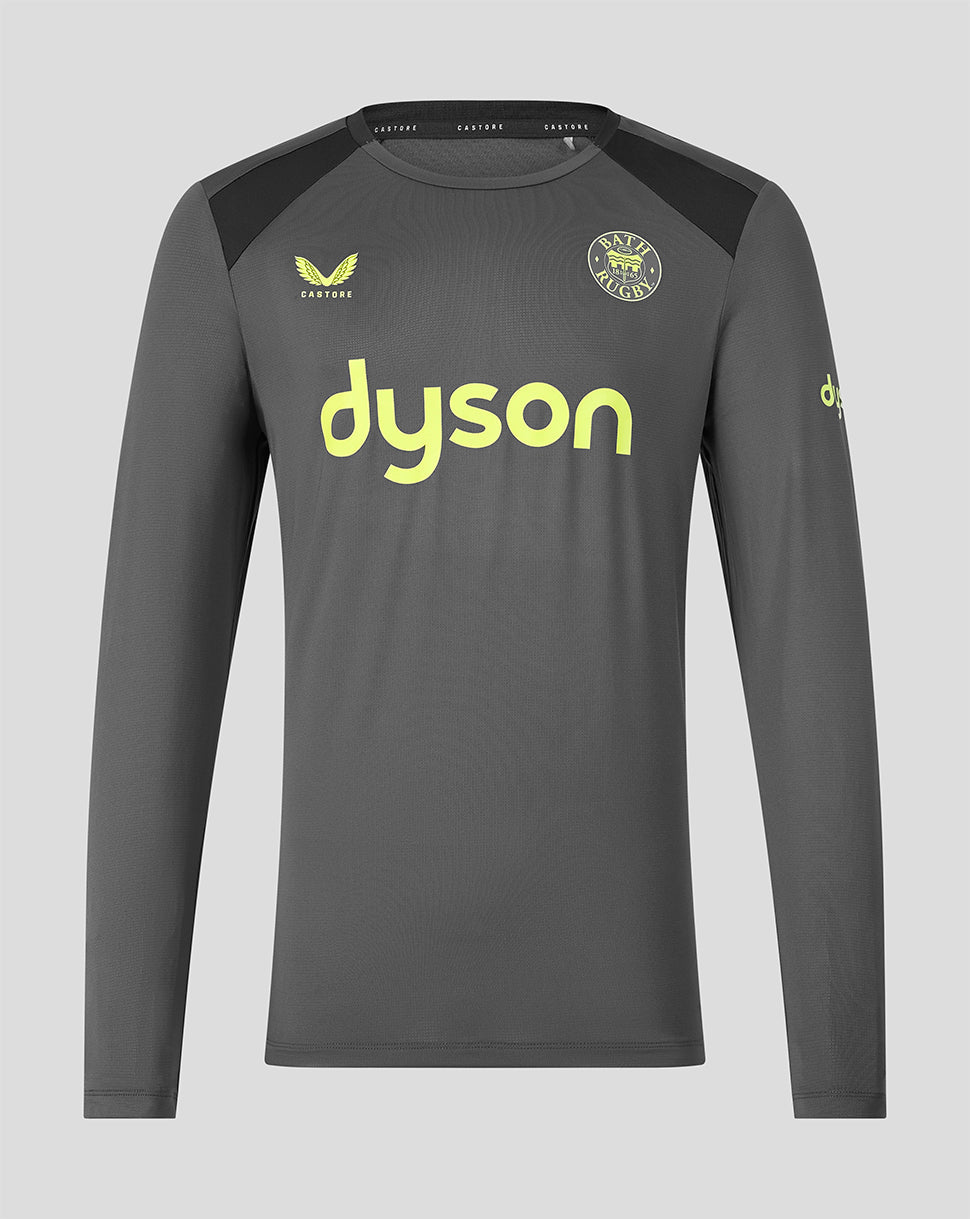 A dark gray long-sleeve athletic jersey with black shoulder panels, featuring a lime green Dyson logo across the chest, a Bath Rugby club crest on the left chest, and a yellow Castore logo on the right chest, shown against a light gray background.