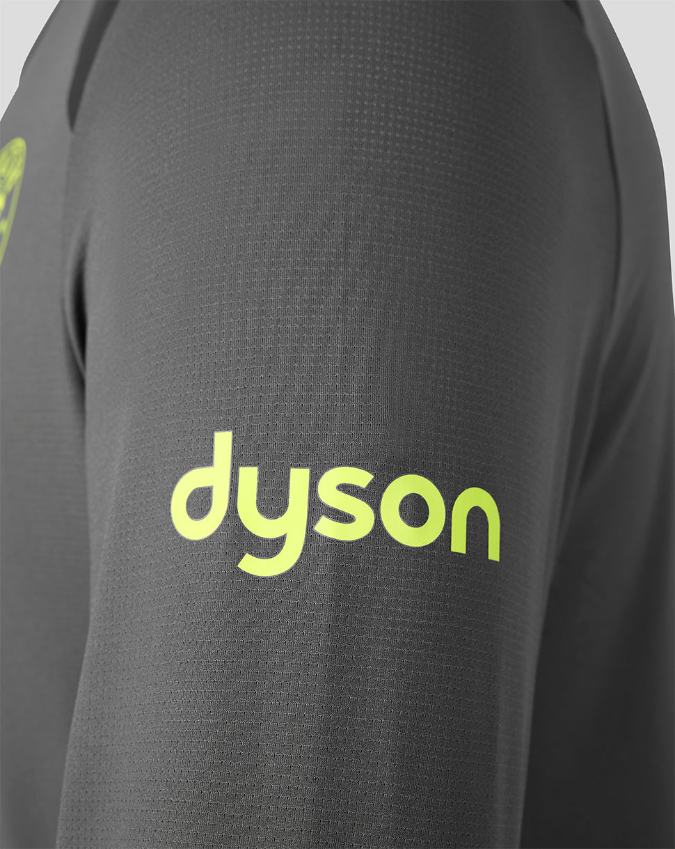 Close-up of a dark gray textured athletic top with a bright neon yellow-green 'dyson' logo printed on the chest.