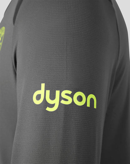 Close-up of a dark gray textured athletic top with a bright neon yellow-green 'dyson' logo printed on the chest.