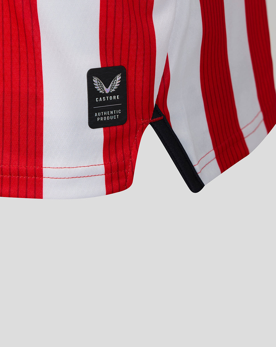 Hem detail of the home shirt with authentic product patch and red white stripes