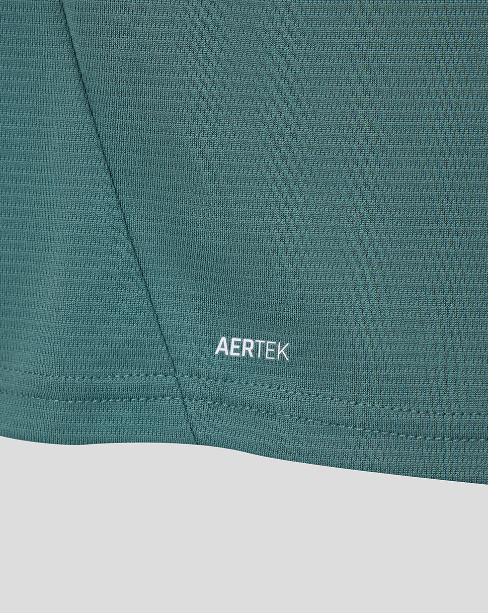 Close up of teal Everton 26/27 third shirt fabric with AERTEK branding near the hem.
