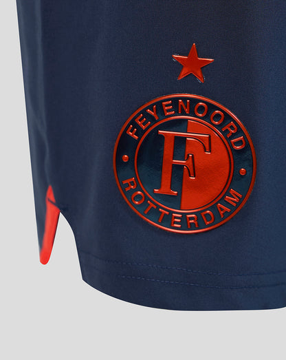 Front view of navy Feyenoord third shorts showing the left leg badge and right leg Castore logo.