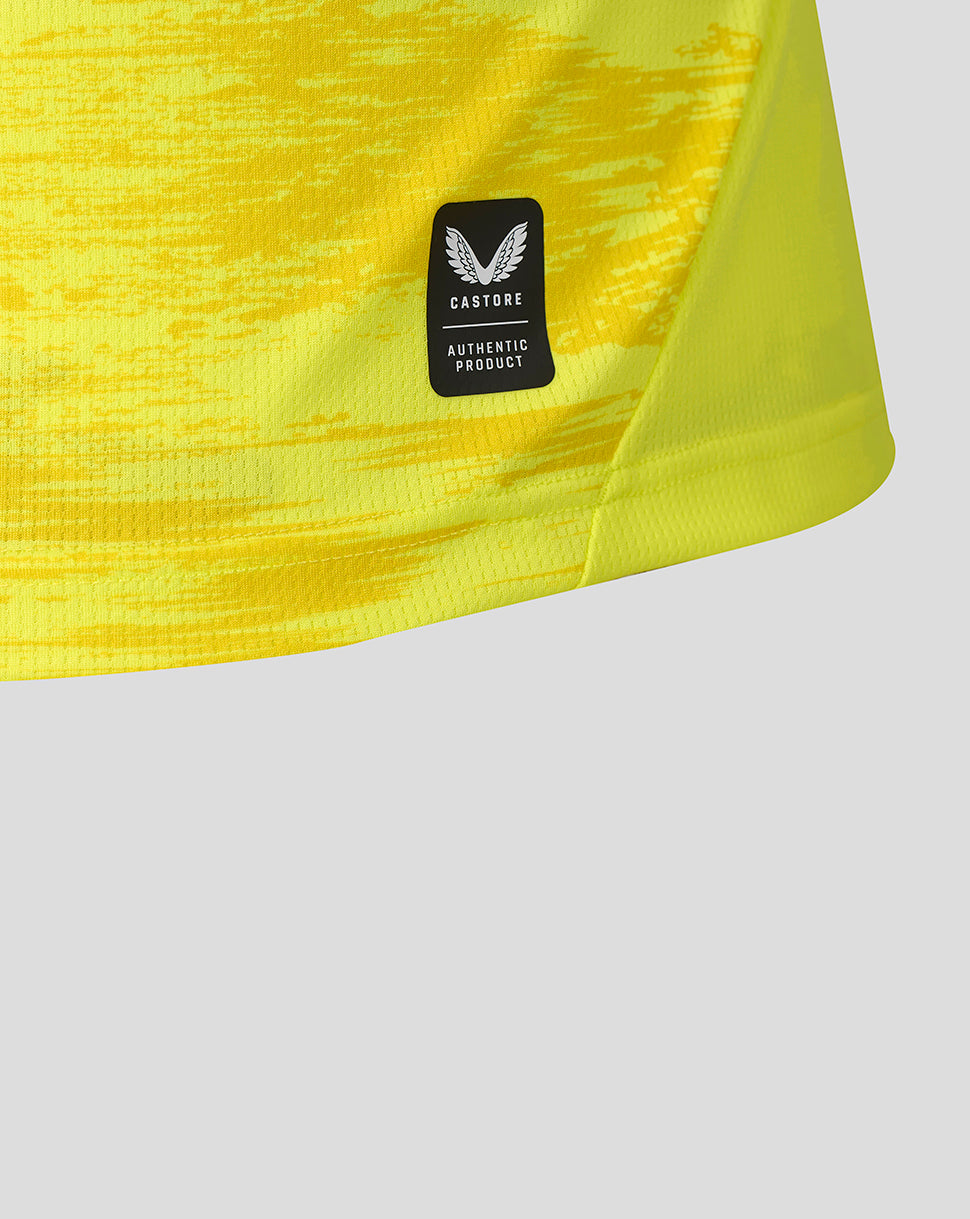 Close-up of bright yellow Feyenoord 2026-2027 Away Goalkeeper Shirt fabric with Castore authentic product patch
