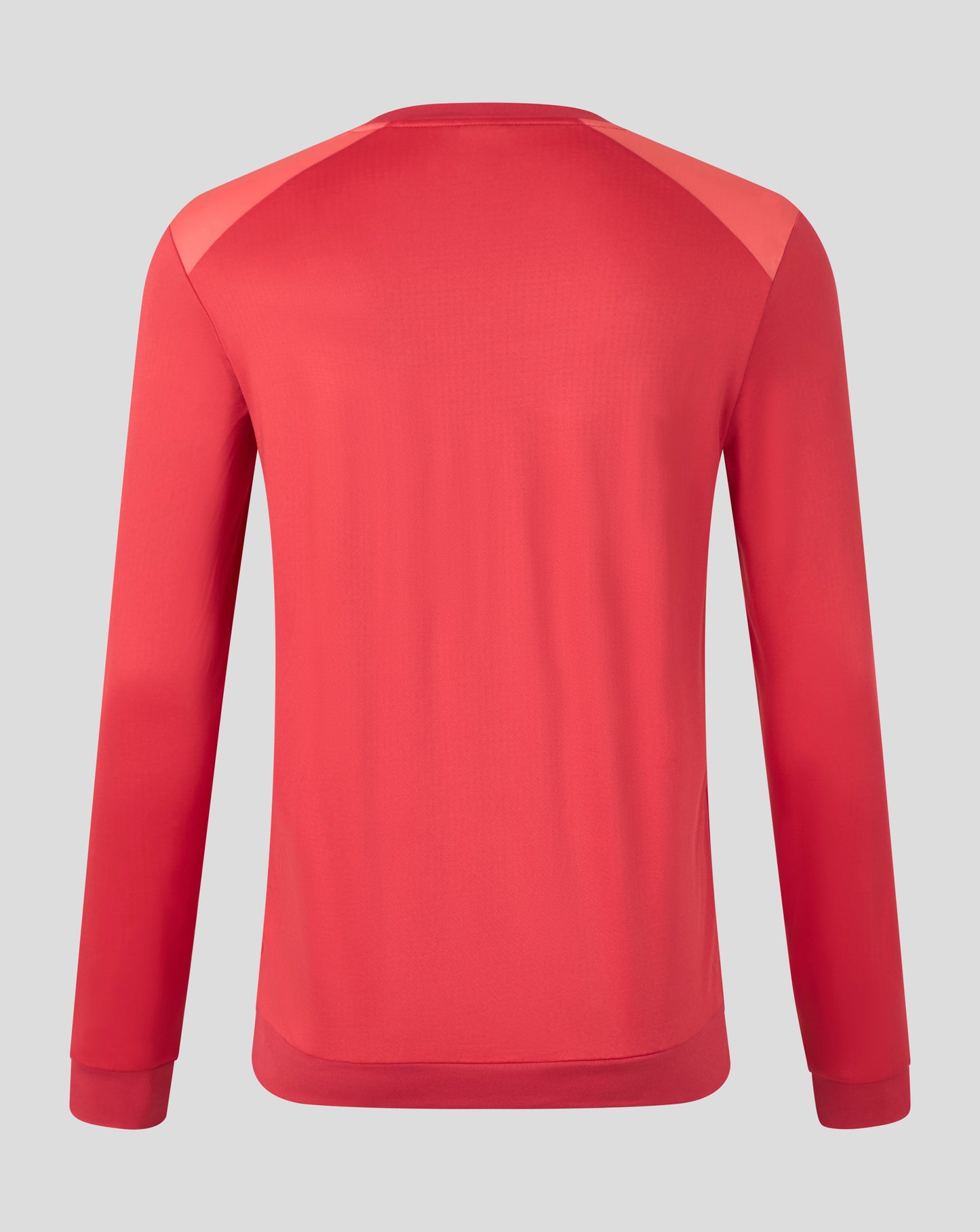 A red long-sleeve athletic top shown from the back, featuring contrasting light red shoulder panels, on a solid gray background.