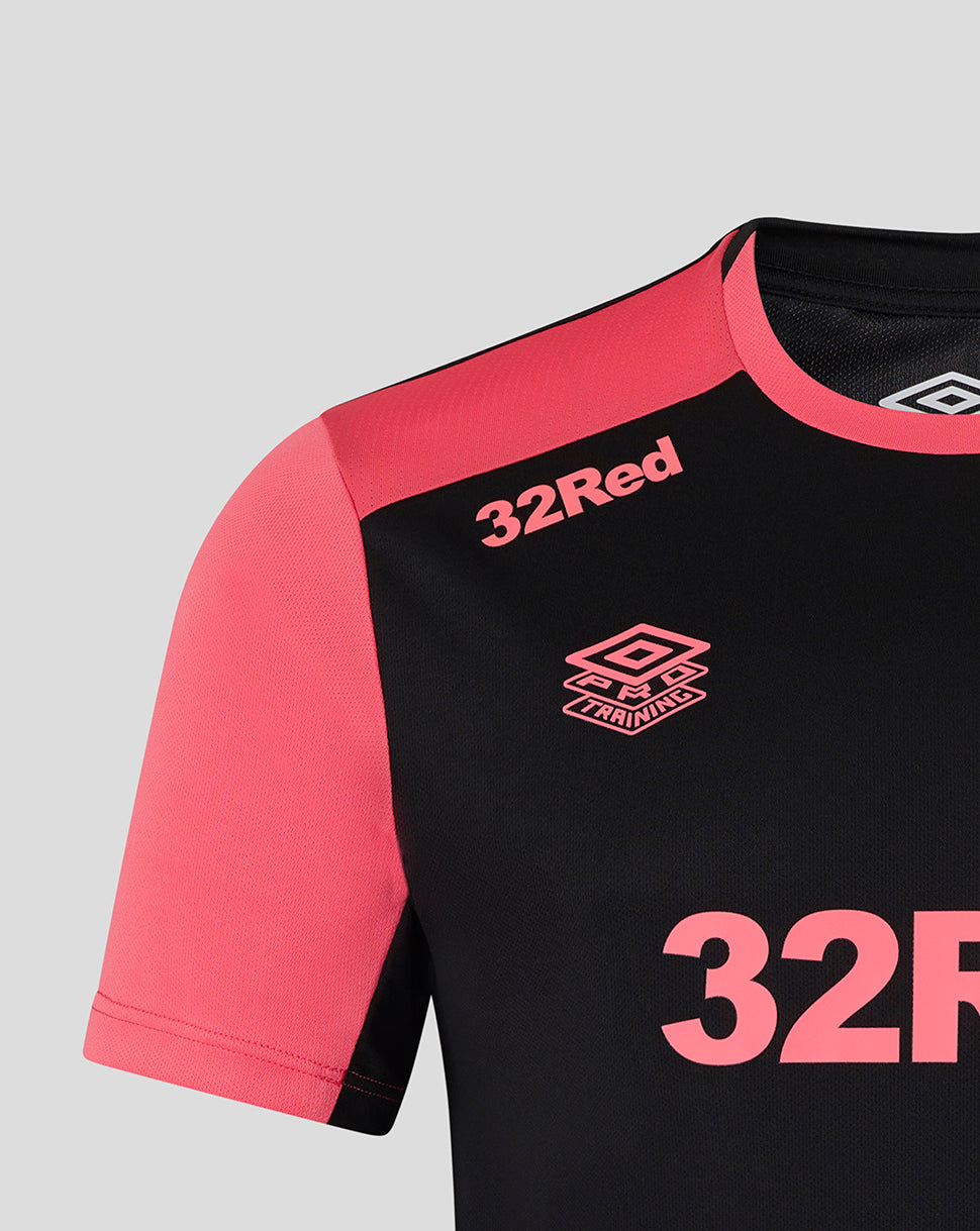 Black and pink sports jersey with '32Red' and Umbro branding on a gray background