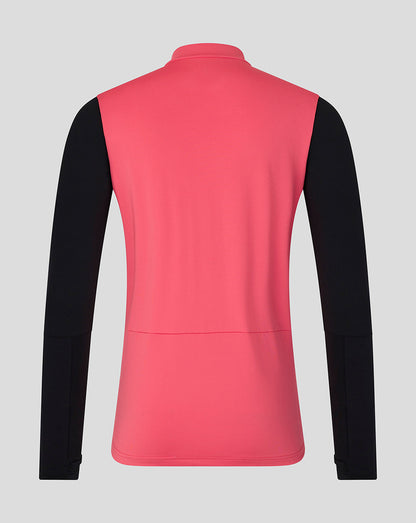 Pink and black long-sleeve shirt on a gray background