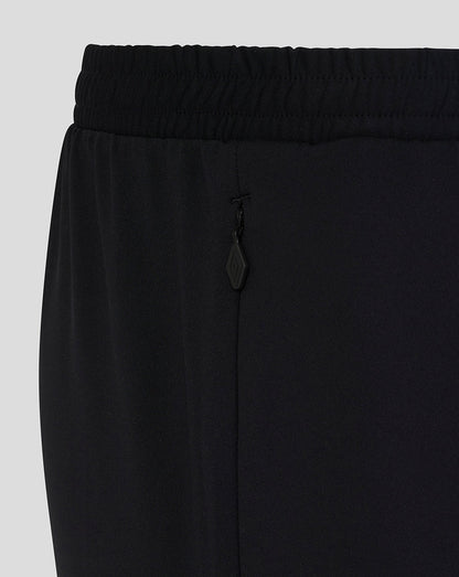 Black pants with a drawstring on a light gray background