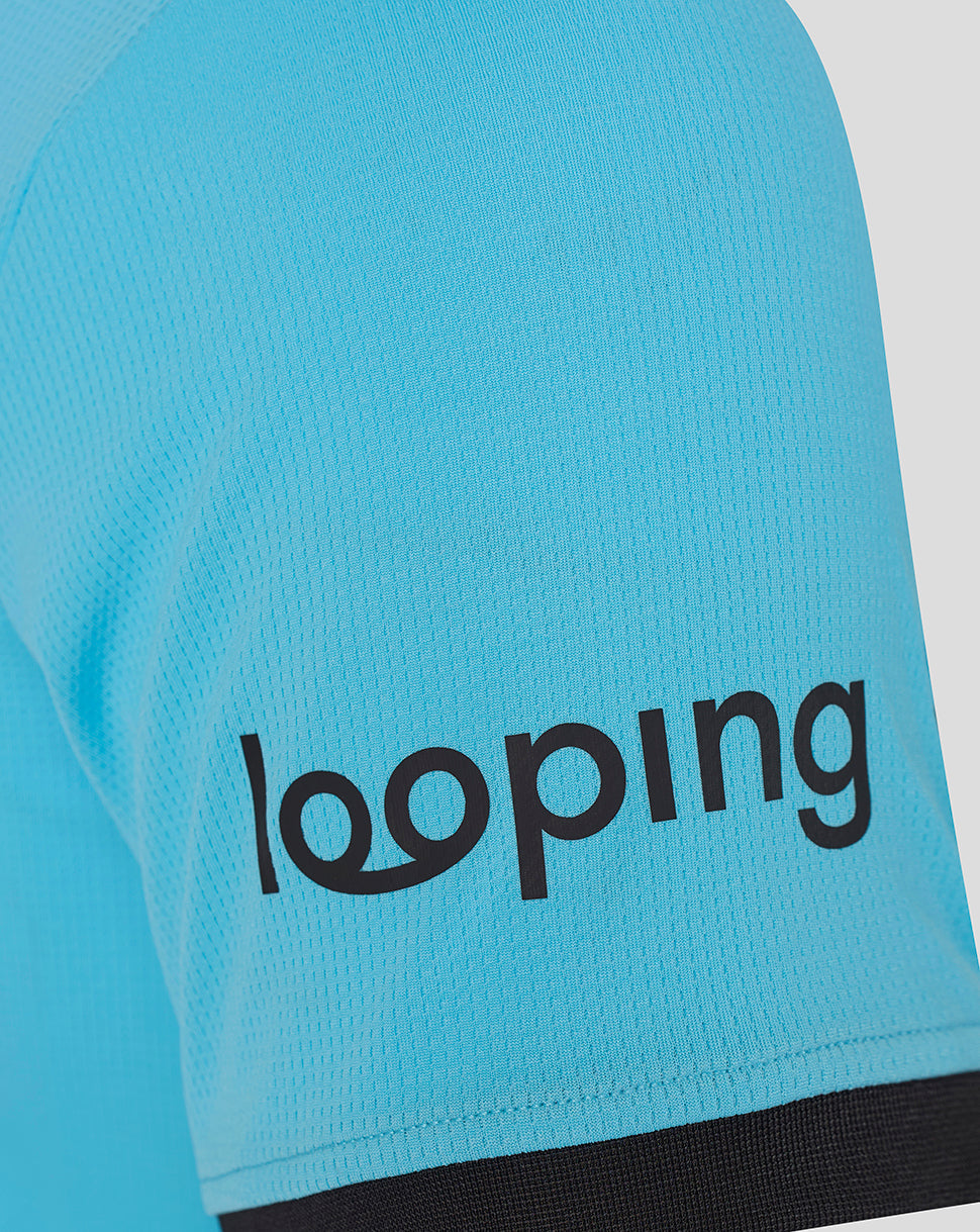 Close-up of turquoise FC Twente away goalkeeper shirt sleeve showing textured mesh fabric and black cuff.