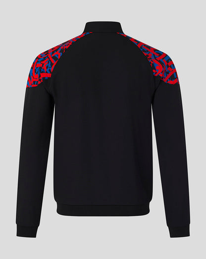 A black long-sleeve quarter-zip sweatshirt shown from the back, featuring a vibrant red and blue abstract patterned yoke on the shoulders, set against a solid light gray background.