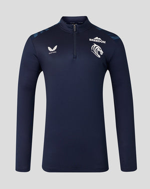 A navy blue long-sleeve quarter-zip athletic top with white branding, including the 'BREEDON' team logo and 'CASTORE' wing logo, displayed on a neutral gray background.