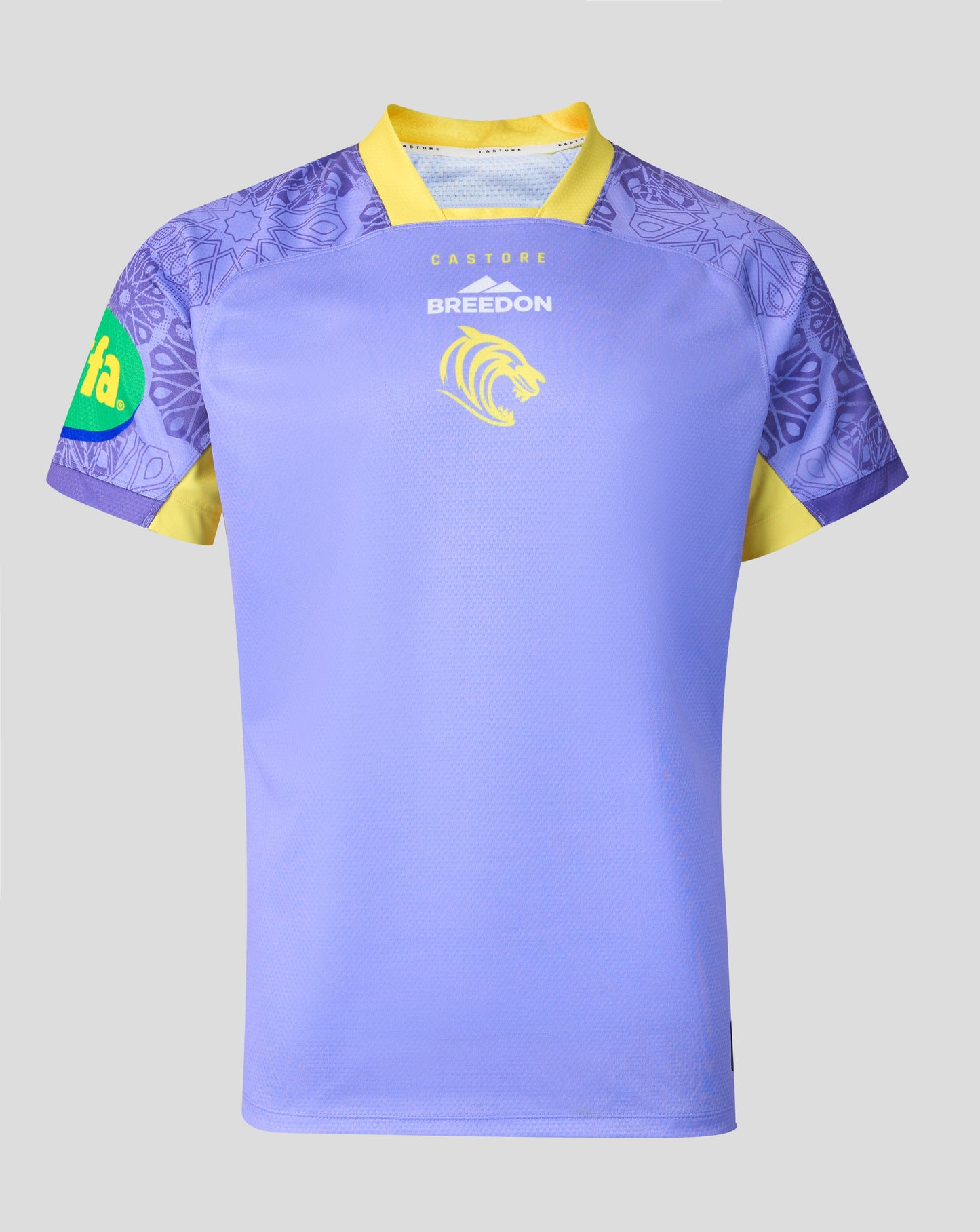 A light purple rugby jersey with yellow trim, featuring a yellow lion crest and the word 'BREEDON' on the chest, and a green and yellow sponsor logo on the sleeve, shown against a neutral gray background.