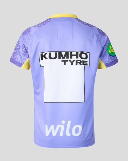 The back of a light purple soccer jersey with yellow collar and sleeve accents, featuring 'KUMHO TYRE' on the upper back, a large white sponsor block, and 'wilo' in white at the bottom.