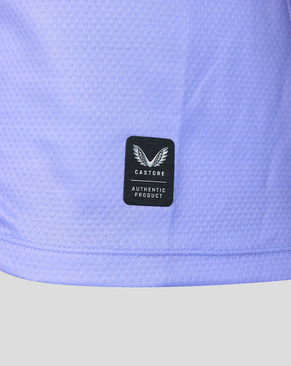 Close-up of a light periwinkle blue athletic jersey with a black Castore Authentic Product patch on the front.