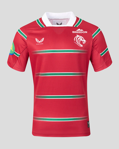 A red short-sleeve rugby jersey with green and white horizontal stripes, featuring the word 'BREEDON' and a lion logo on the chest, and the Castore wing logo on the opposite chest.