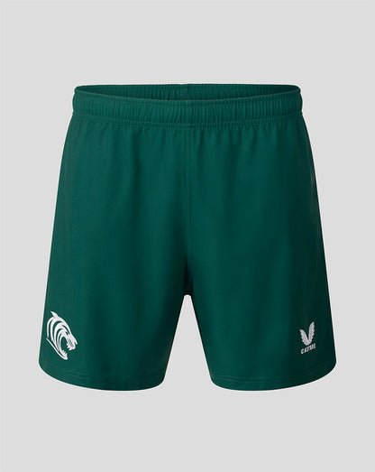 Dark green athletic shorts with a white printed logo on the left leg and a white brand logo on the right leg, shown against a solid gray background.