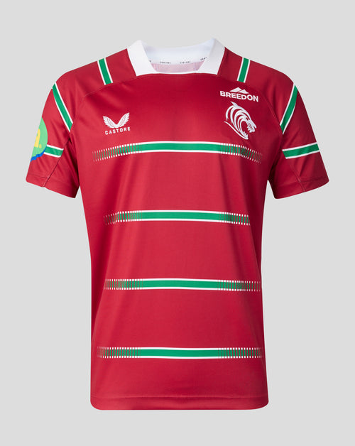 A red short-sleeve rugby jersey with green and white horizontal stripes, featuring the Castore logo on the right chest and the Breedon logo on the left chest, displayed on a neutral gray background.