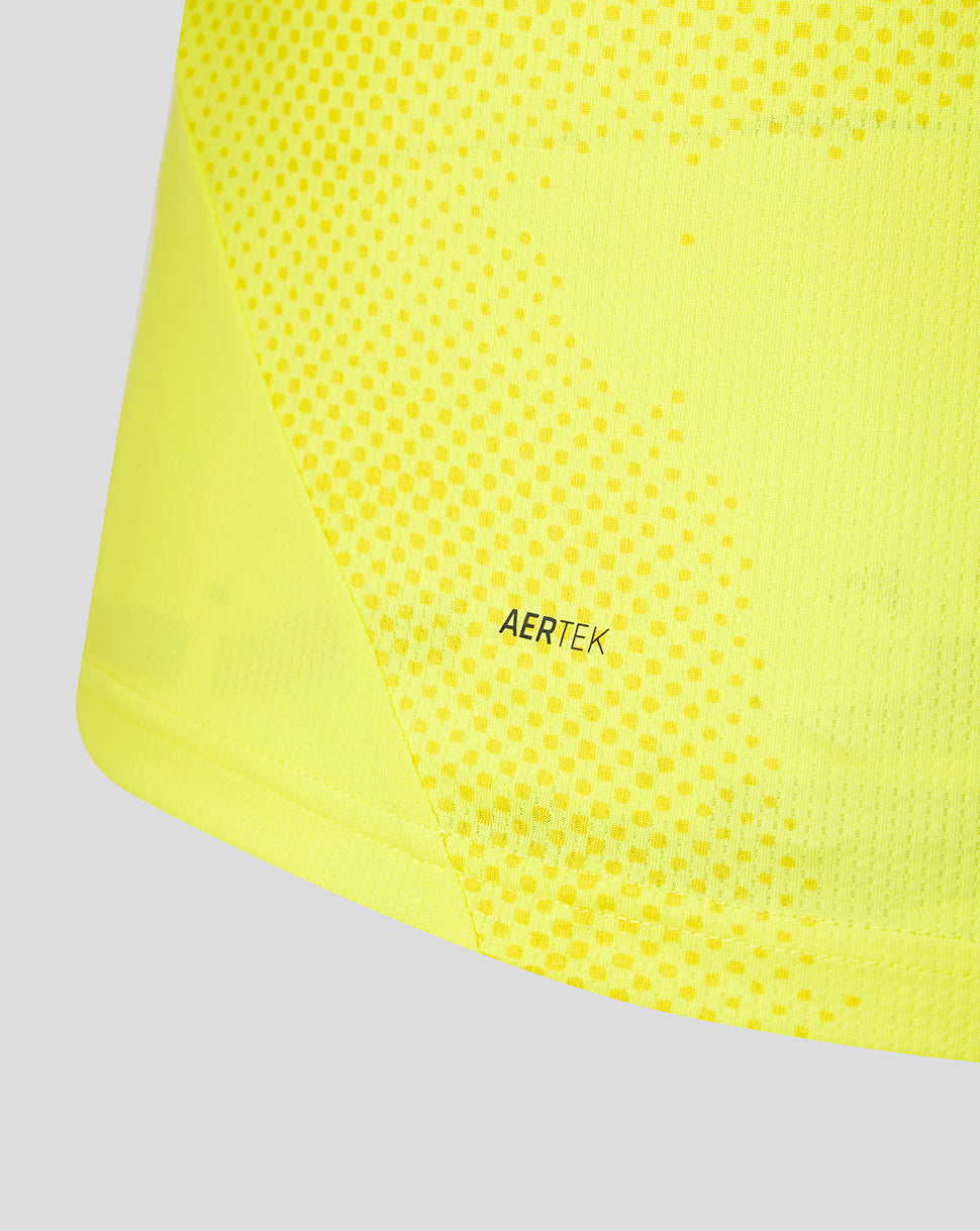 Close up of neon yellow FC Utrecht away goalkeeper shirt fabric with dotted texture and AERTEK label