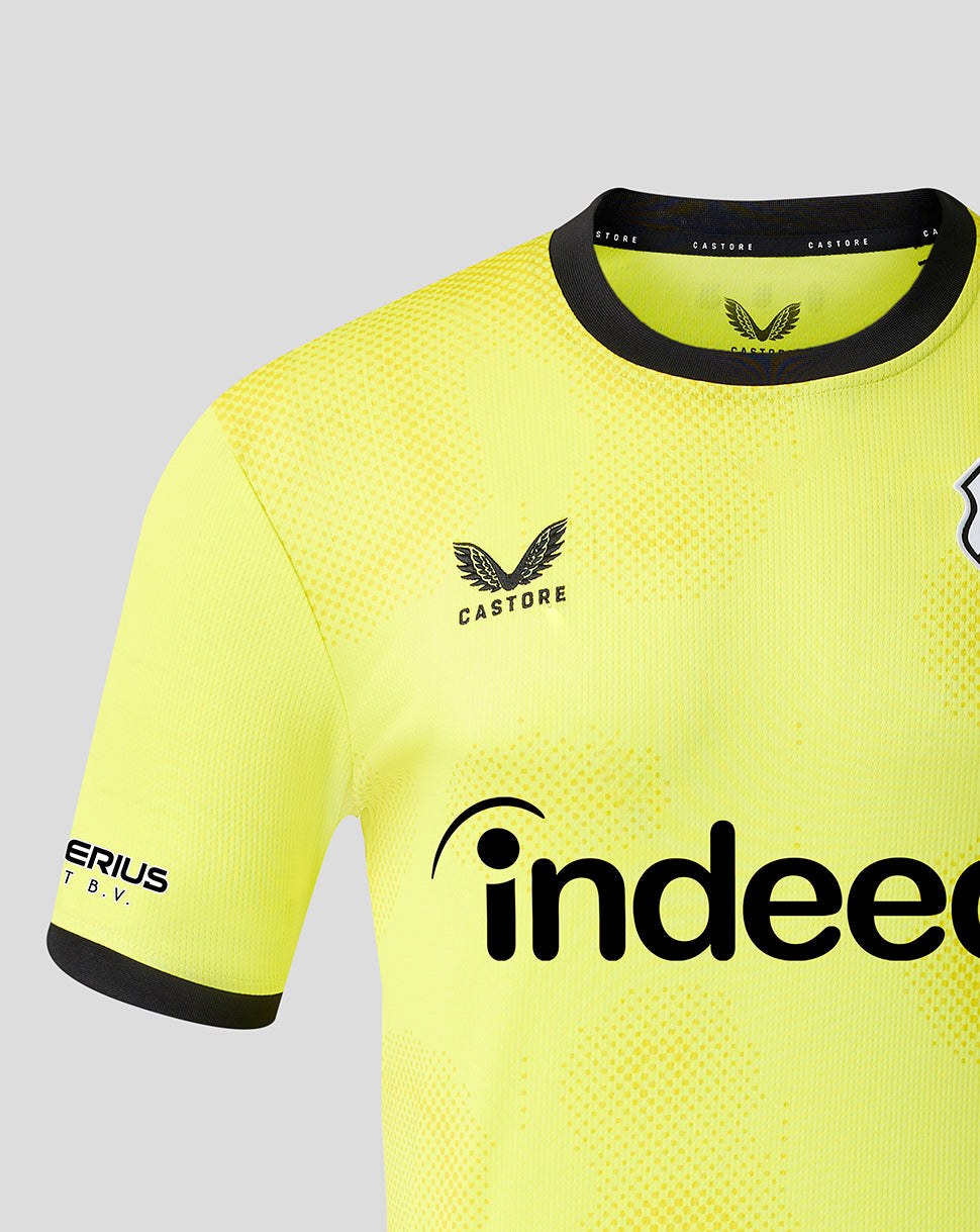 Close-up of neon yellow FC Utrecht goalkeeper shirt showing crest on left chest dotted texture and Castore branding on the collar