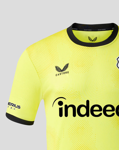 Close-up of neon yellow FC Utrecht goalkeeper shirt showing crest on left chest dotted texture and Castore branding on the collar
