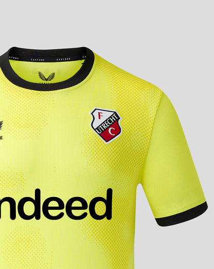 Front view of neon yellow FC Utrecht goalkeeper shirt with crest, dotted pattern and Indeed sponsor across the chest